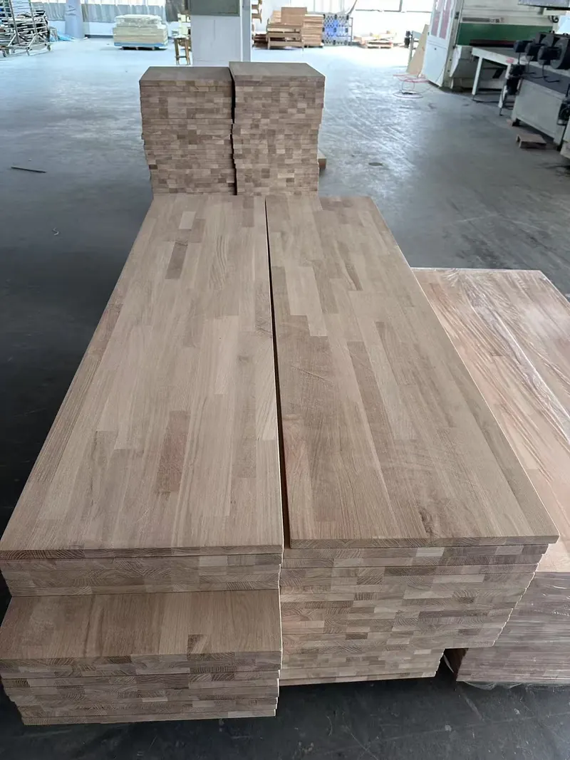 Solid wood countertop panels on pallets Solid wood countertop panels stacked on pallets in factory